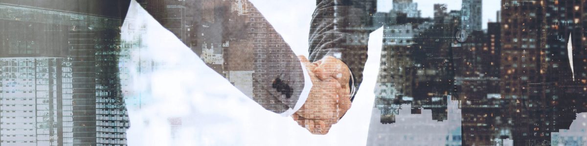 Corporate business handshake between business partners Corporate business handshake between business partners
